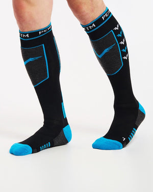 XTM Valentino merino snow socks worn mid-stride, three-quarter view of the left and right fit