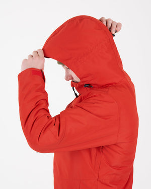 Boy pulling the peaked hood of the Lava XTM Kids Titanium III Snow Jacket over his head