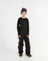 XTM Kids Bailey Ski Pant in Black, front view on a child, bib cut with shoulder straps
