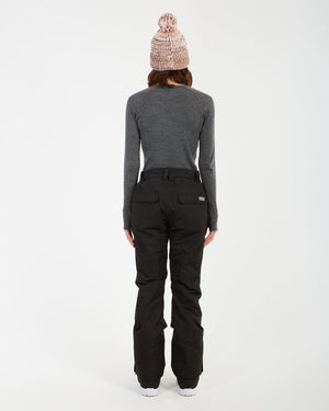 Back view of a woman in the black XTM Smooch women's ski pants