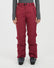 Front view of the XTM Smooch women's ski pants in Boysenberry worn with ski boots