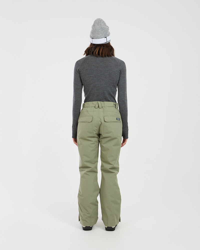 Back view of a woman in the Light Khaki XTM Smooch ski pants