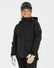 Woman wearing the XTM Elevation II ski jacket in black, front view zipped up with goggles and mittens