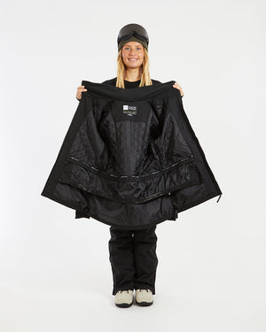 Black XTM Elevation II jacket held open to show the quilted lining and powder skirt