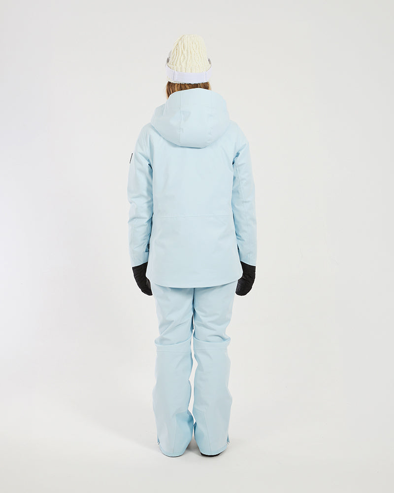 Back view of the Sky Blue XTM Elevation II women's ski jacket worn with matching pants