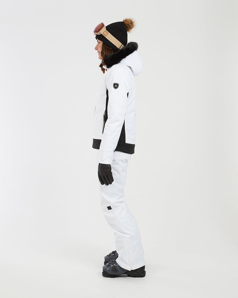 Side profile of the white XTM Solace jacket showing the black side panel and sleeve badge