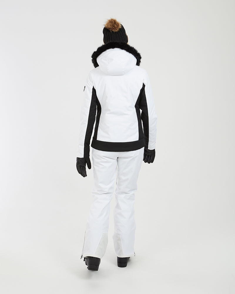 Back view of the white XTM Solace jacket with black panels and black fur trim