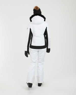 Back view of the white XTM Solace jacket with black panels and black fur trim