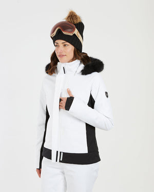Close-up of a woman in the white XTM Solace jacket with a thumb-hole cuff at the chest