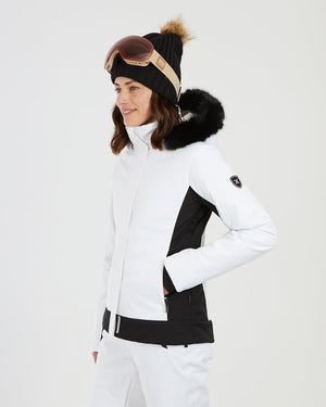 Three-quarter view of the white XTM Solace jacket with a hand in the hand warmer pocket