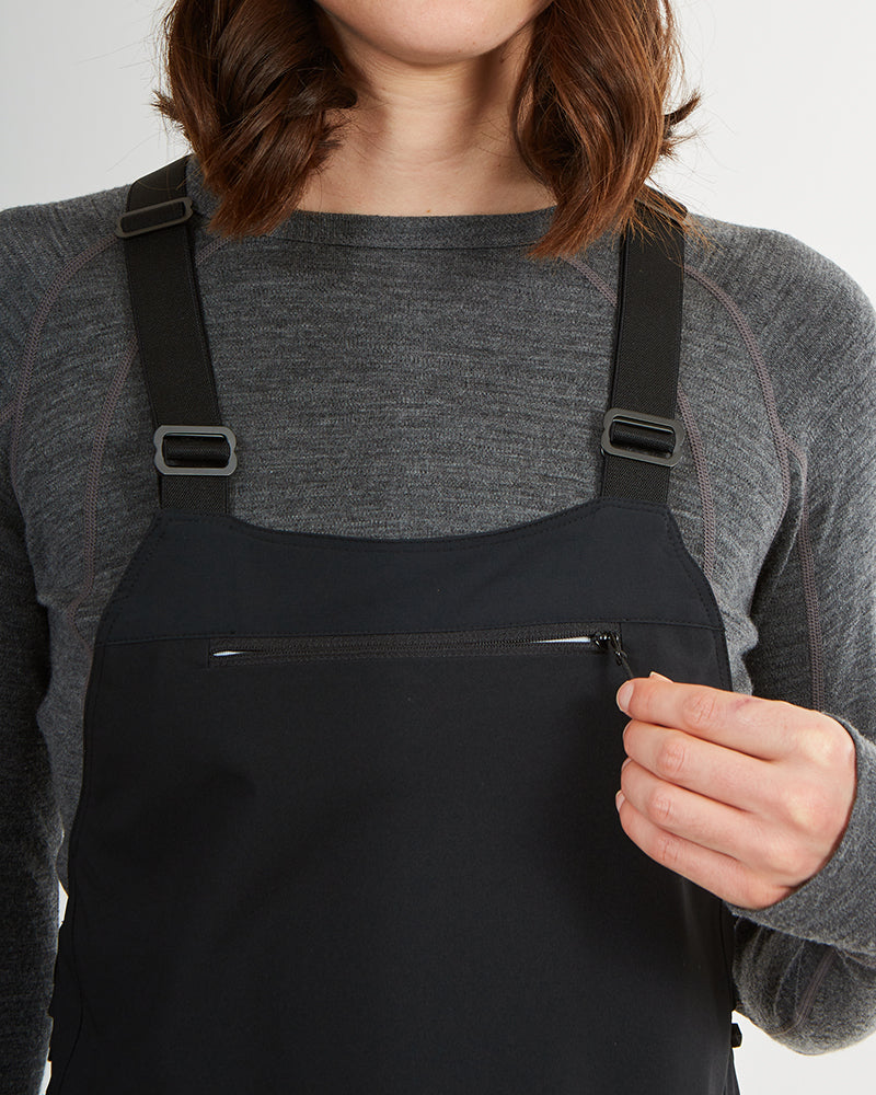 Close-up of the zipped chest pocket and suspenders on the black XTM Stellar 2.0