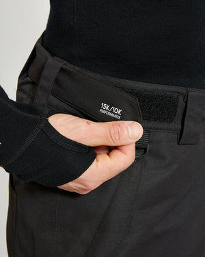 Close-up of the velcro external waist adjuster on the Black XTM Glide ski pant