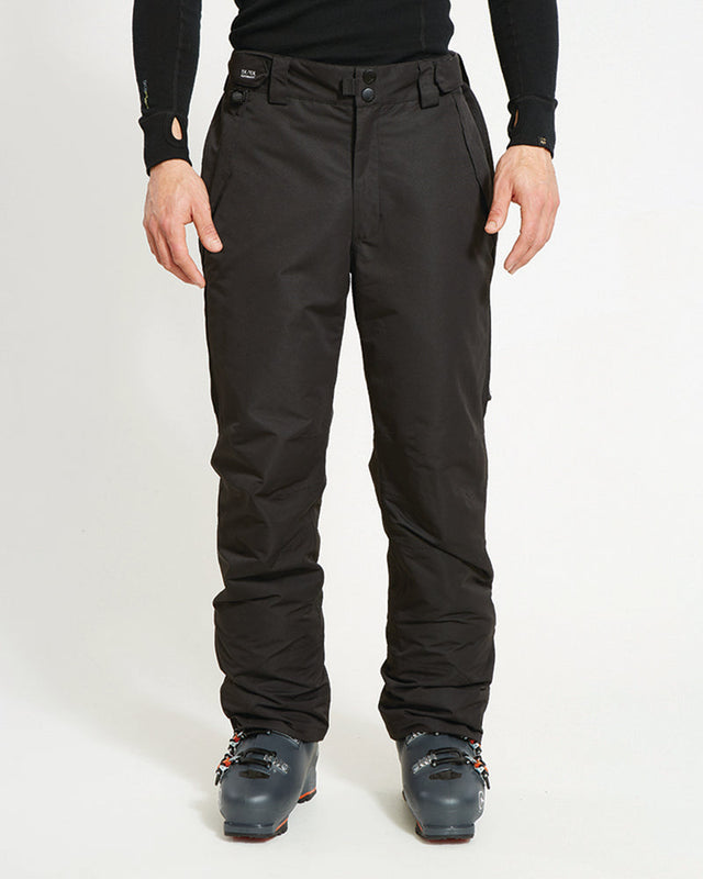 XTM Glide men's ski pant in Black, front view worn with ski boots