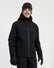 XTM Quantum men's snow jacket in Black, front view on a model wearing goggles and gloves