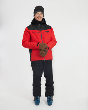 Crimson Red XTM Quantum snow jacket, front view of the model pulling on gloves