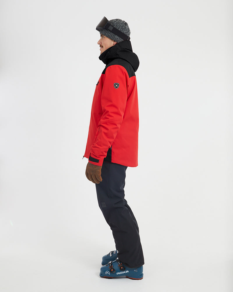 Side profile of the Crimson Red XTM Quantum snow jacket and its black hood