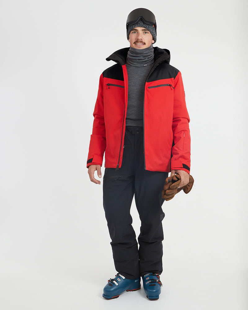 Crimson Red XTM Quantum snow jacket worn open over a base layer, full-length view