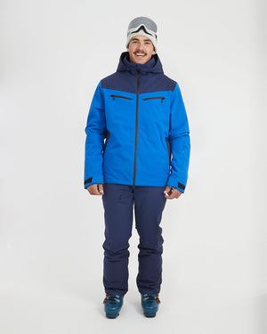 Full-length front view of the Marine Blue XTM Quantum snow jacket with navy pants