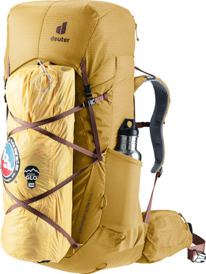 Deuter Aircontact Ultra 50+5 with a yellow stuff sack strapped to the front and a bottle in the side pocket