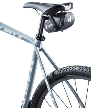 Deuter Bike Bag 0.3 strapped under the saddle of a pale grey gravel bike