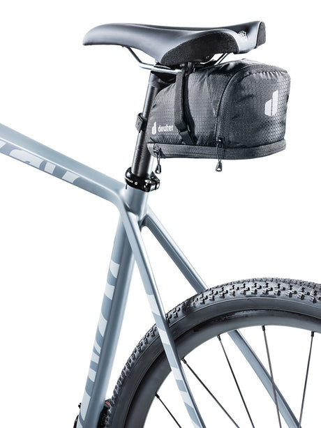 Deuter Bike Bag 1.1 + 0.3 in black mounted under the saddle of a grey gravel bike