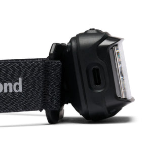 Side of the Black Diamond Storm in Black showing the charging port cover