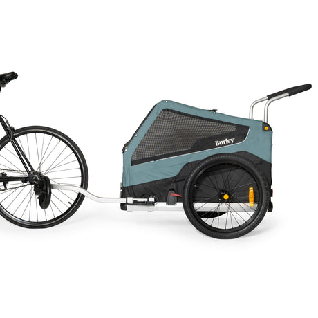 Burley Bark Ranger hitched behind a bicycle as a dog bike trailer, side view