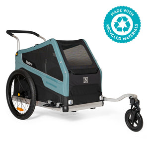 Burley Bark Ranger dog trailer in blue-grey and black, front three-quarter view with stroller wheel fitted