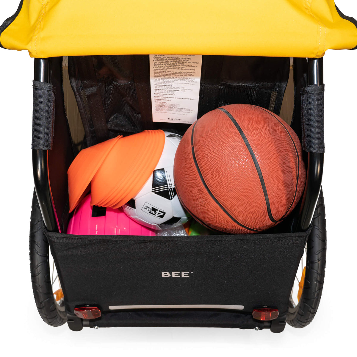 Burley Bee Single rear cargo area holding a basketball and sports gear