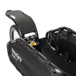 Close-up of the Burley Coho XC rear rack and yellow coil-spring shock above the wheel