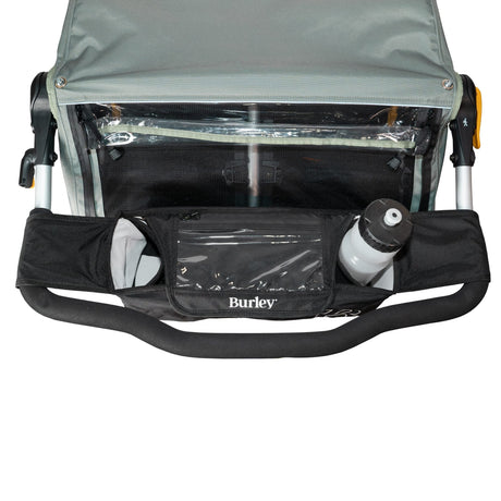 Burley Handlebar Console strapped to a child trailer handlebar with a water bottle in one cup holder
