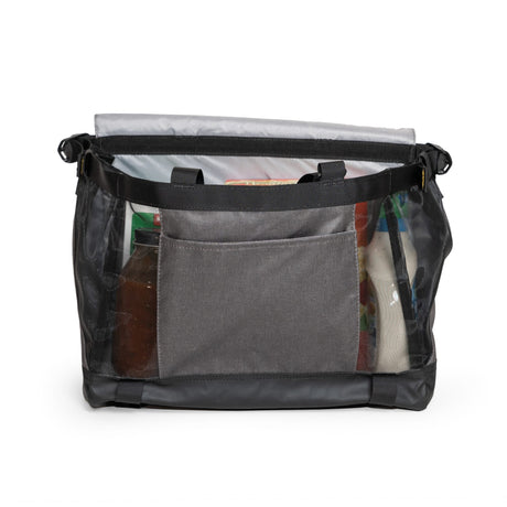 Burley Upper Market Bag with flap open, loaded with groceries behind the front slip pocket and mesh sides