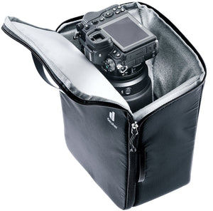 Deuter Camera Box One, side view with the lid open and a camera with lens inside