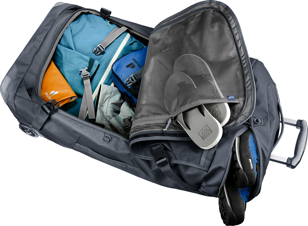 Deuter Duffel Pro Movo 90 opened flat through the front zip, packed with clothes and shoes