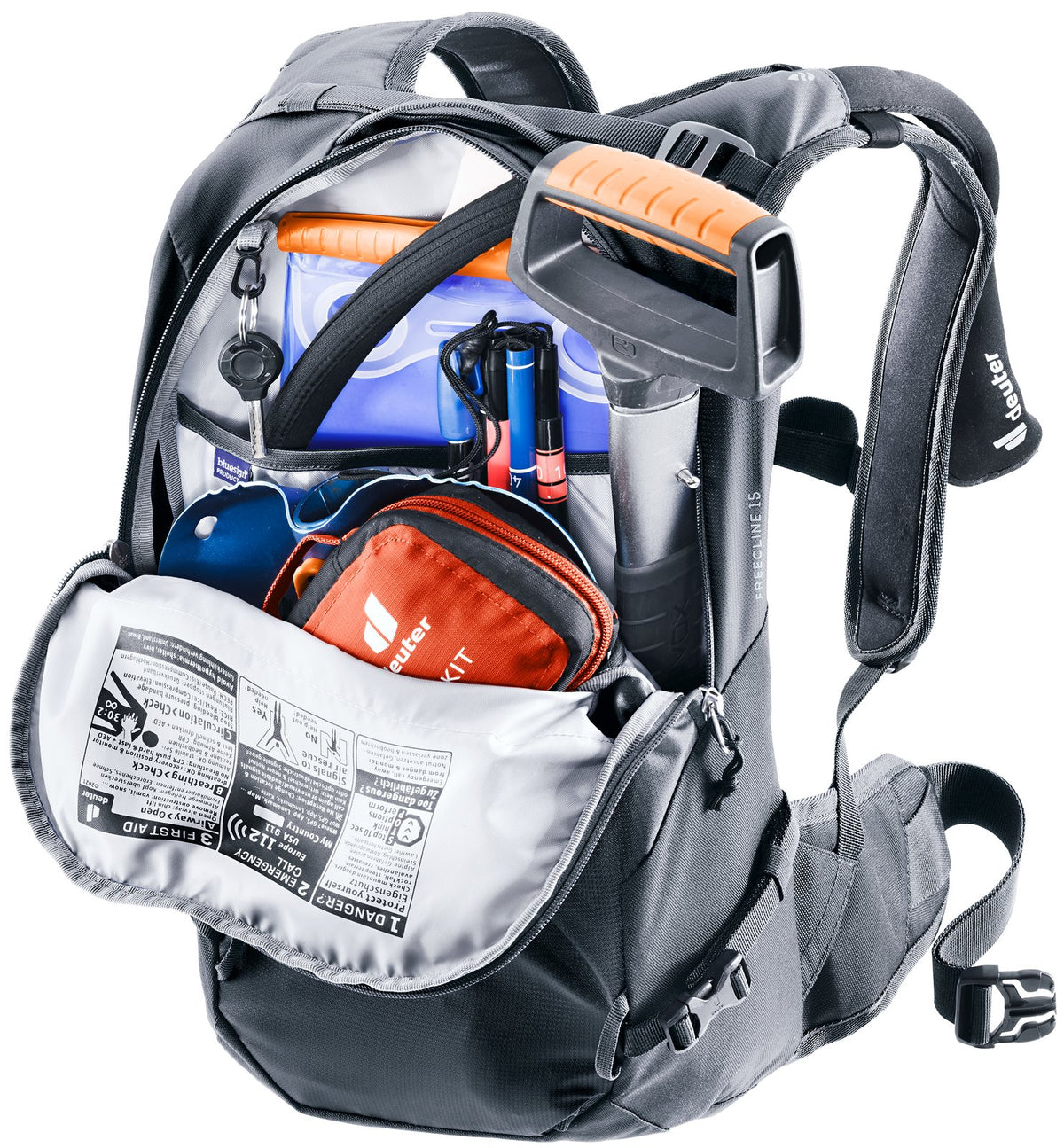Deuter Freecline 15 safety compartment open with an avalanche shovel, probe and first aid kit