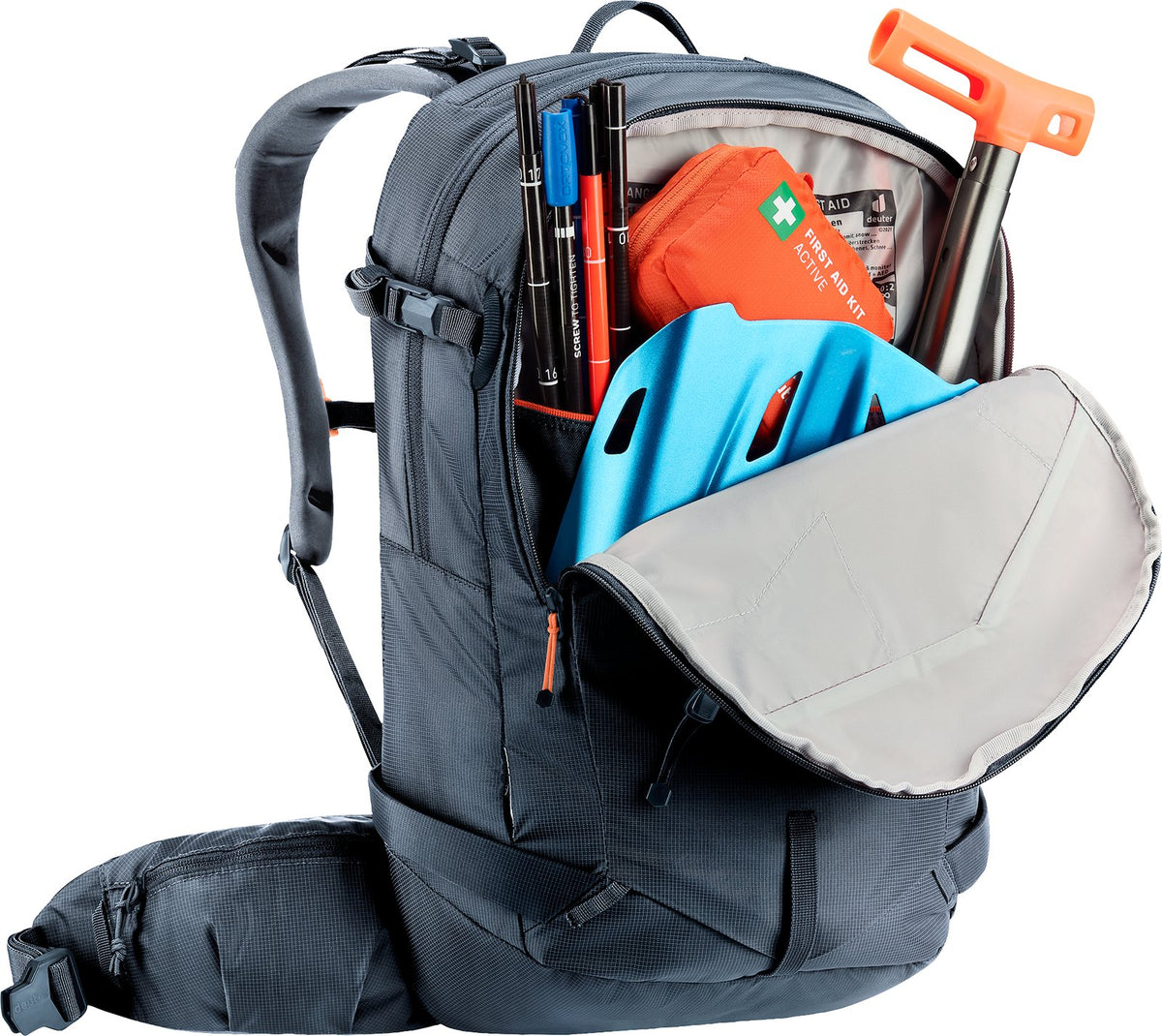 Deuter Freerider 22 SL avalanche pocket open, holding a shovel blade, handle, probe and first aid kit