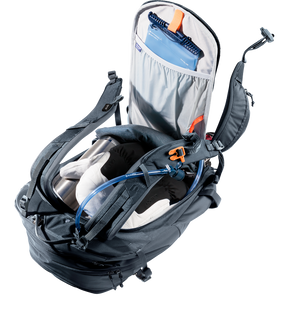 Deuter Freerider 30 opened through the back panel, showing a hydration bladder and packed layers