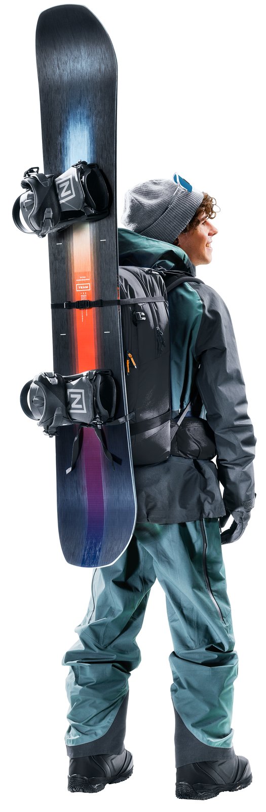 Snowboarder wearing the Deuter Freerider 30 with a snowboard strapped on the front