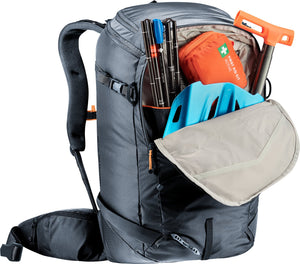 Deuter Freerider Pro 30+10 SL avalanche pocket open with a shovel blade, probe and first aid kit
