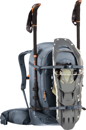 Deuter Freerider Pro 30+10 SL carrying snowshoes on the front and poles at the sides