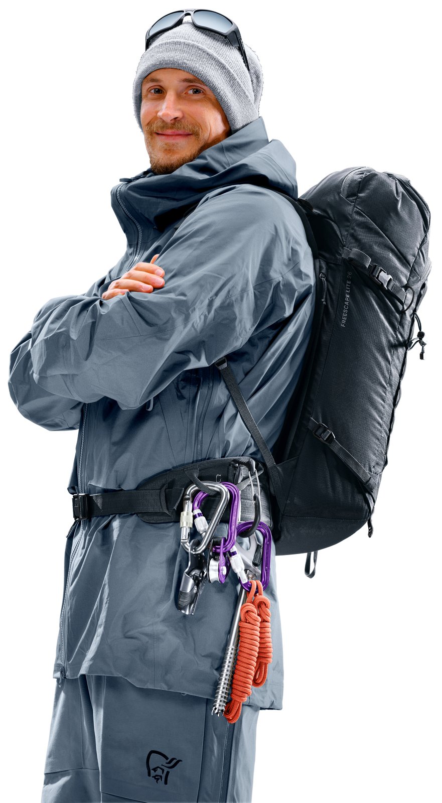 Ski mountaineer wearing the Deuter Freescape Lite 26 with gear clipped to the hip fin loop