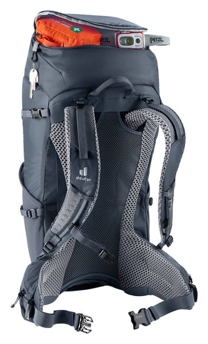 Deuter Futura 32 lid pocket open with a first aid kit and head torch, keys hanging from the key clip