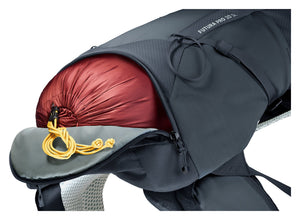 Separate bottom compartment of the Deuter Futura Pro 30 SL holding a red sleeping bag