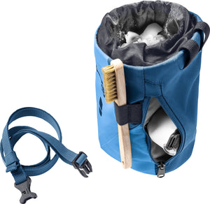 Deuter Gravity Chalk Bag II L with waist strap unclipped, a brush in the side loop and a zipped pocket open