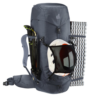 Deuter Guide 44+6 with a helmet in the mesh holder, poles and a foam mat strapped on