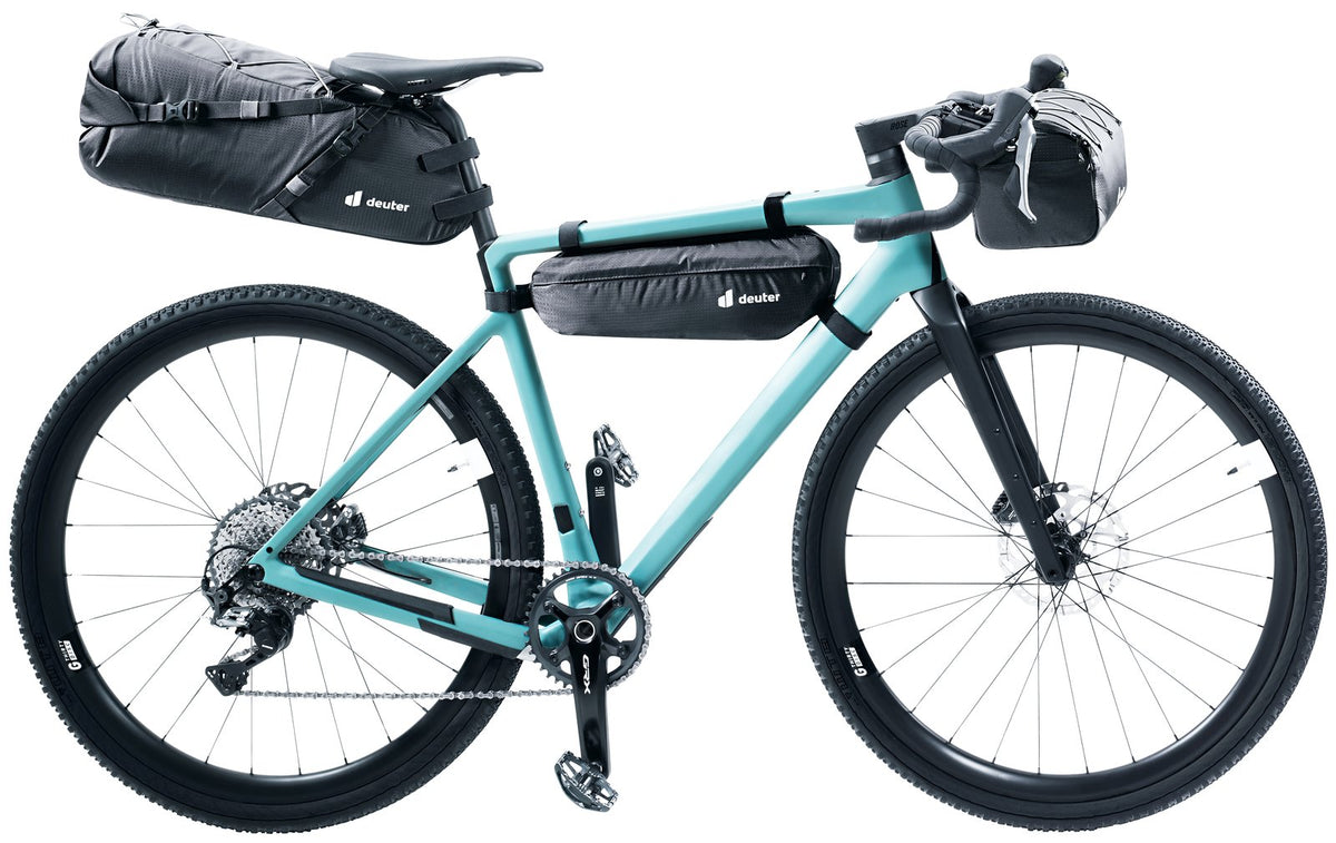 Teal gravel bike with a full Deuter Mondego bikepacking set, including the HB 8 on the handlebars