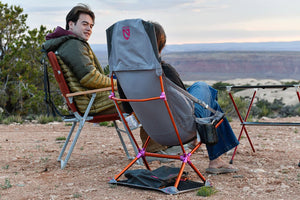 Friends talking in camp chairs on a dry plateau, Nemo Satellite in Quicksilver in front