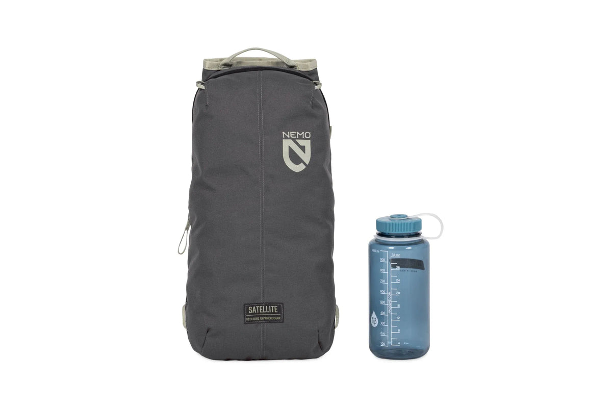 Nemo Satellite carry case in dark grey packed next to a drink bottle