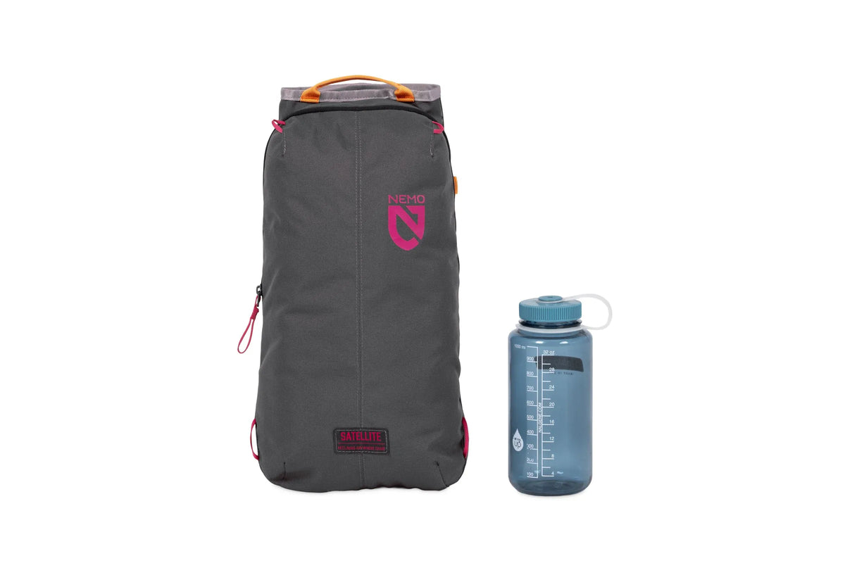 Nemo Satellite carry case in Quicksilver with pink logo beside a drink bottle