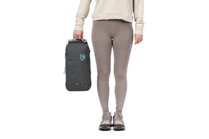 Person holding the packed Nemo Satellite carry case by its handle